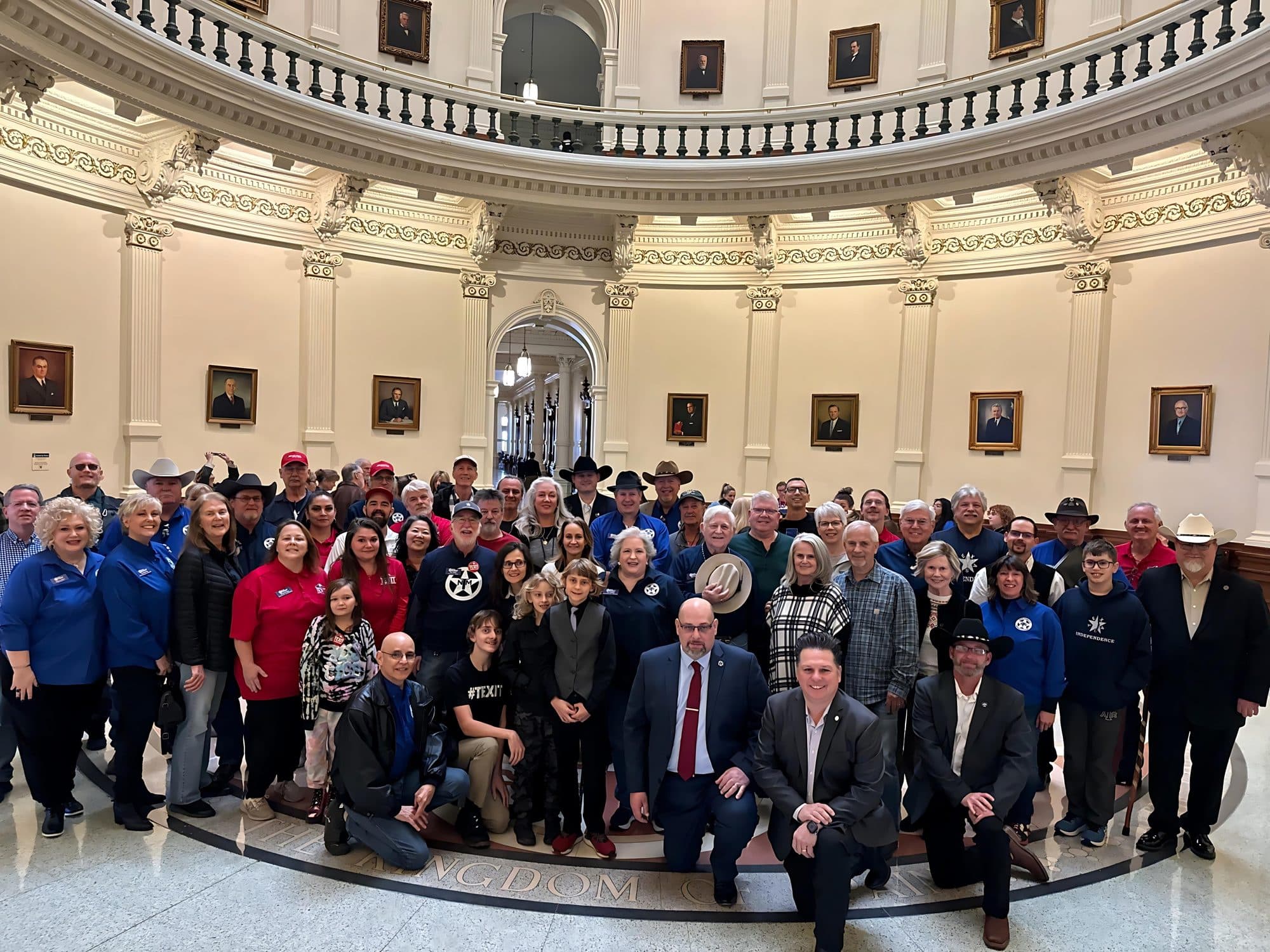 Texas Nationalist Movement supporters gathered in the rotunda of the Texas Capitol